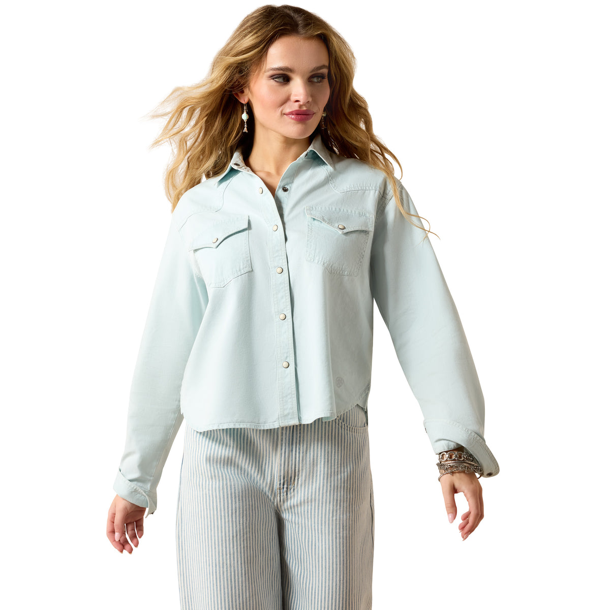 Ariat Women's Asheville Snap Shirt in light wash indigo denim, featuring snap closures and classic shirt design.