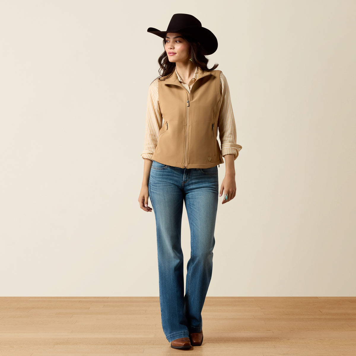 Ariat Women's Atlas Vest in Tiger's Eye color, featuring a sleeveless design with quilted pattern and front zipper.