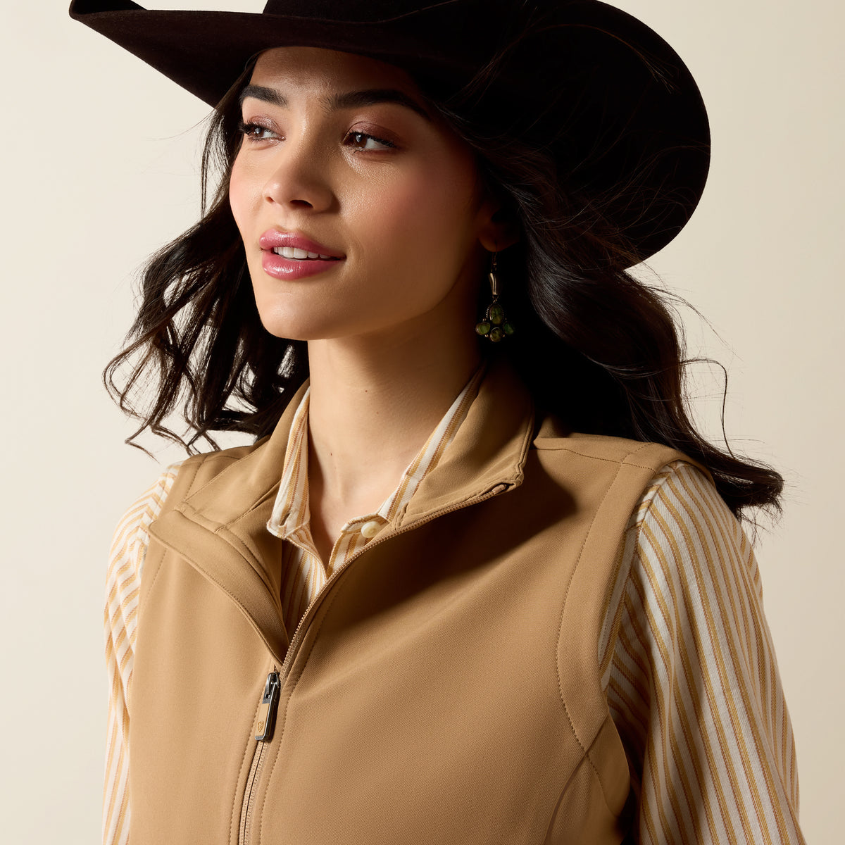Ariat Women's Atlas Vest in Tiger's Eye, featuring a sleeveless design with a front zipper and quilted pattern.