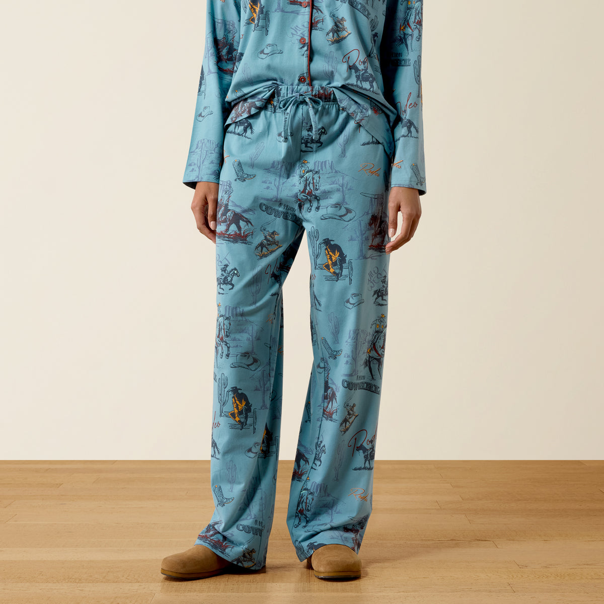 Ariat Women's Dreams Pajama Set in retro rodeo style, featuring a comfortable top and matching pajama pants with rodeo print.