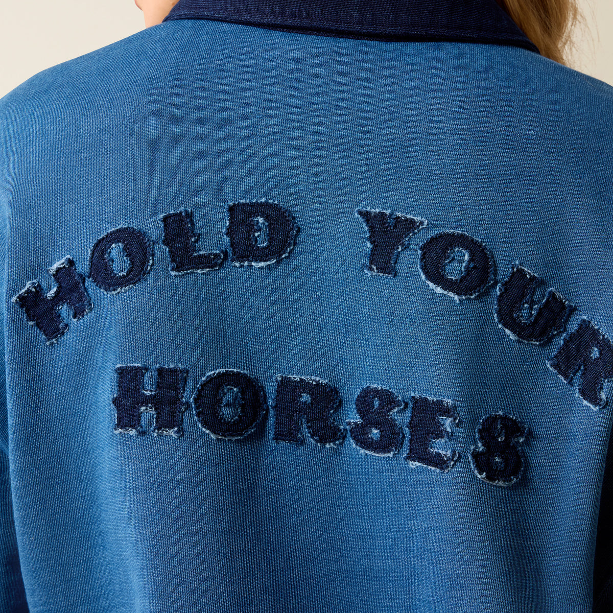Ariat Women's Hold Your Horses Indigo Sweatshirt showing a cozy, casual fit with a printed horse graphic on the front.