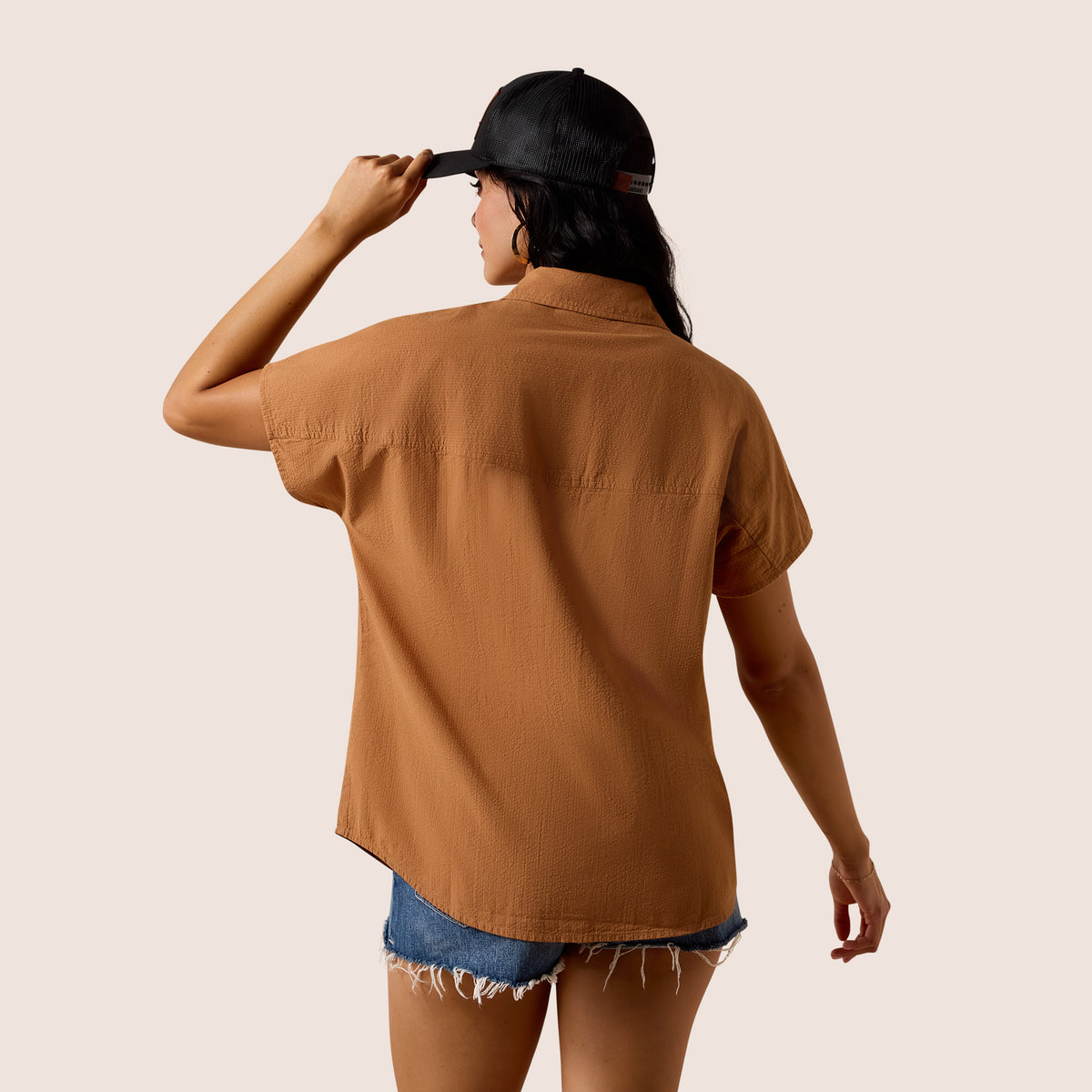 Ariat women's saddle brown vacation shirt, casual button-up with collar and long sleeves, made from lightweight fabric.