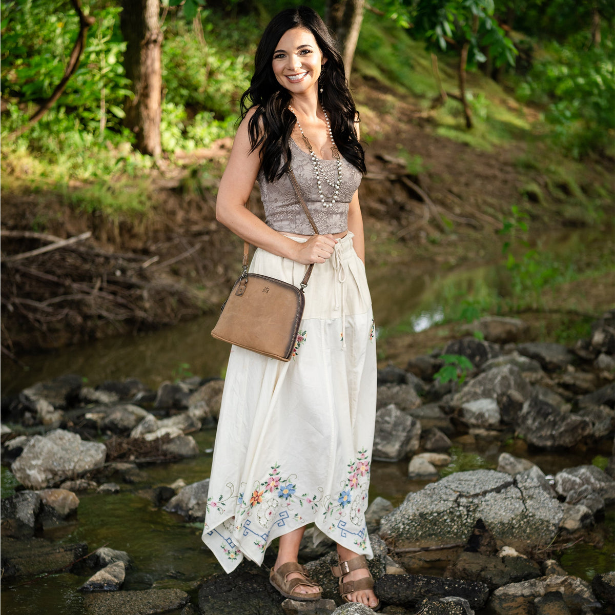 Black STS Ranchwear Baroness Weezy crossbody bag with detailed leather accents and adjustable strap.
