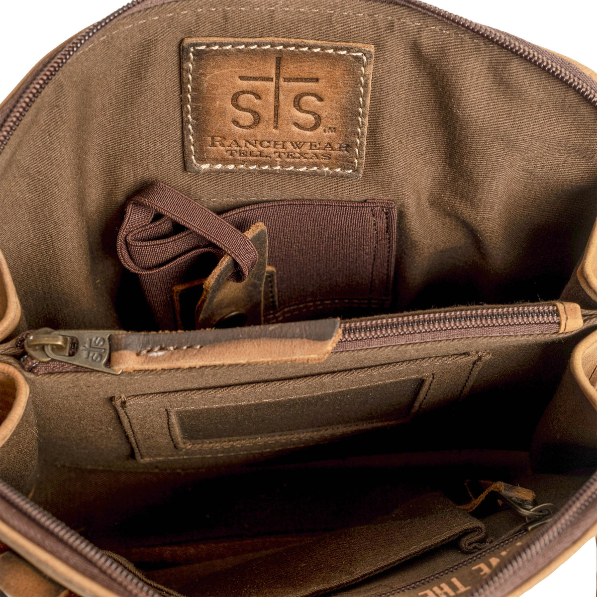 STS Ranchwear Baroness Weezy Crossbody bag with leather strap and rustic design, showcasing Western style and craftsmanship.