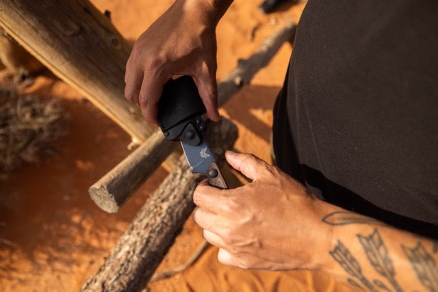Benchmade Dacian knife with brown canvas Micarta handle and spear-point blade, showcasing a sleek, durable design.