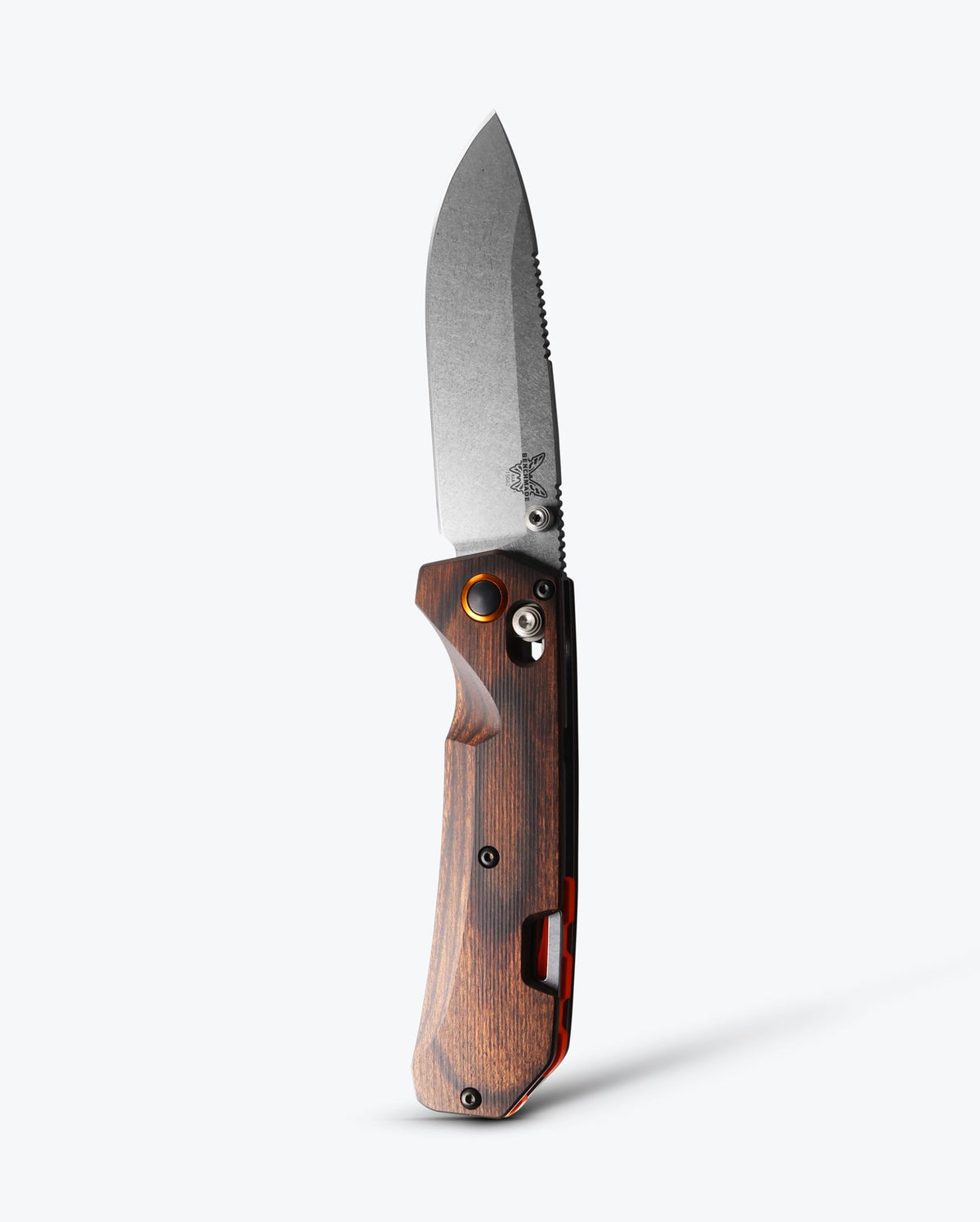 Benchmade Grizzly Creek knife with stabilized wood handle and drop-point blade, showcasing a sleek, durable pocket knife design.