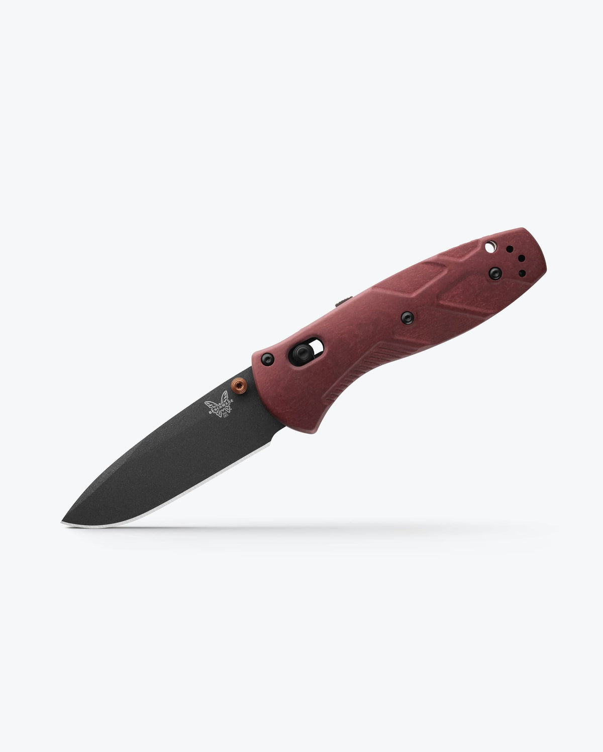 Benchmade Mini Barrage knife with redstone handle and drop-point blade, showcasing a sleek, compact folding knife design.