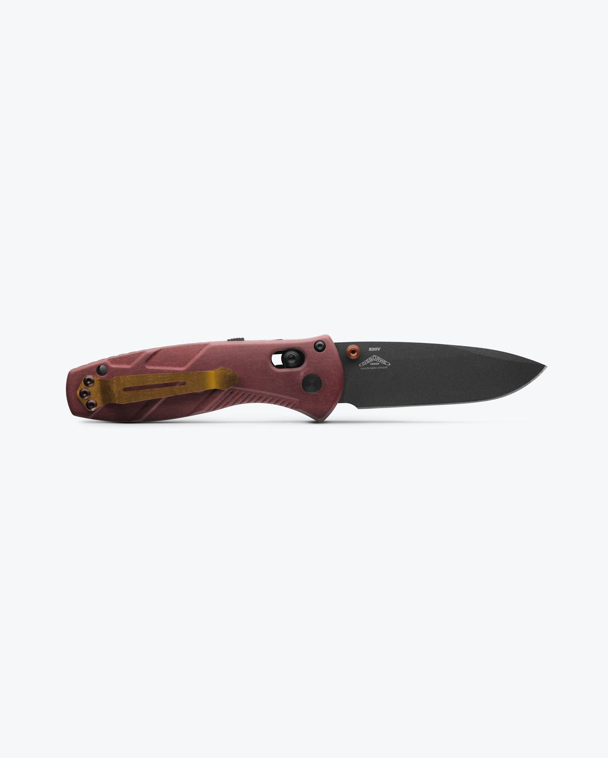 Benchmade Mini Barrage knife with a redstone handle and drop-point blade, compact and versatile for everyday carry.