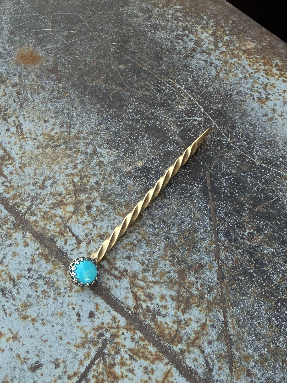Boles Silver cowboy toothpick featuring silver brass and sterling silver with turquoise stone accents and detailed cowboy design.