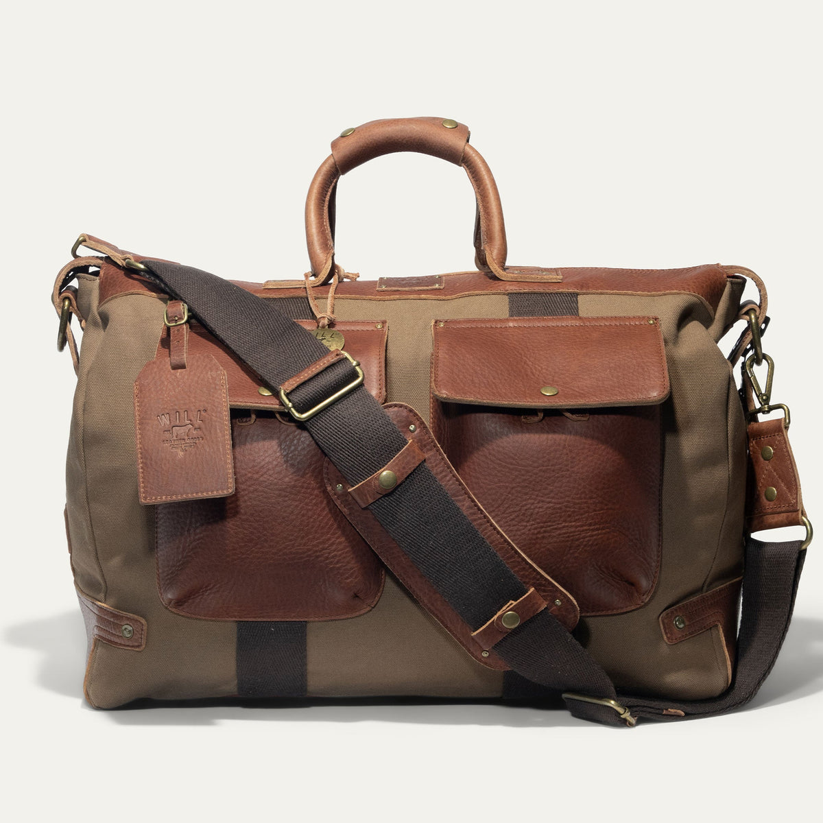 Will Leather Goods canvas and leather travel duffle bag with sturdy handles and spacious interior, perfect for weekend trips.
