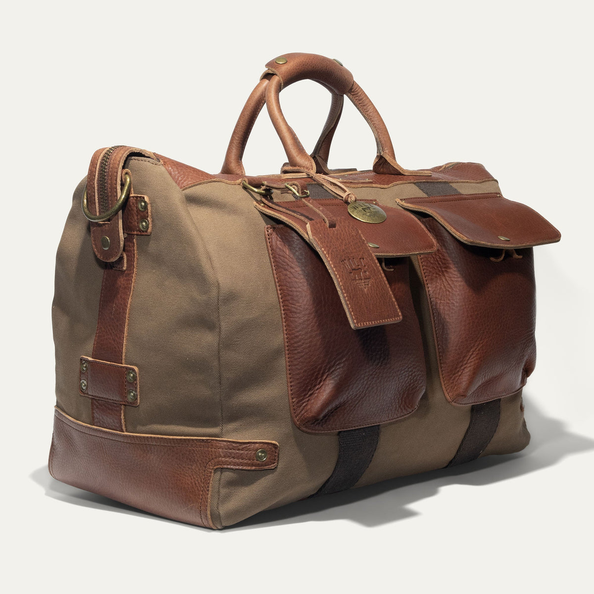 Will Leather Goods canvas and leather travel duffle bag with sturdy handles and spacious interior for weekend trips.