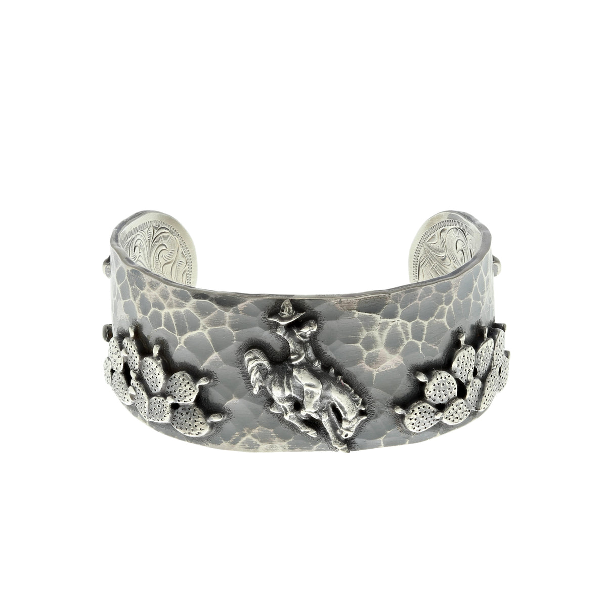 Clint Orms 1432 sterling silver cuff bracelet with a bronc rider and cactus overlay on a hammered band