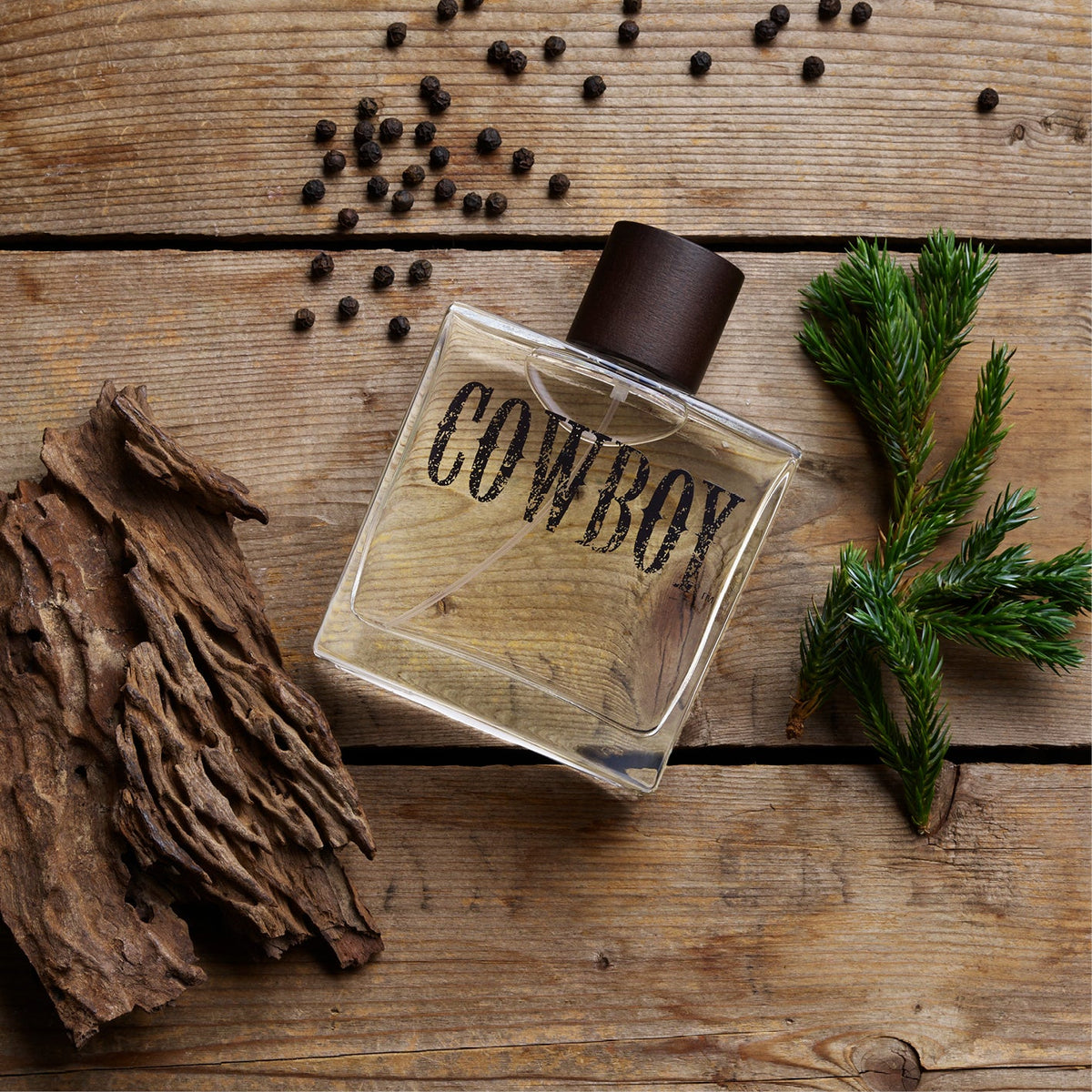 Tru Fragrance & Beauty Cowboy Cologne bottle with cowboy-themed label, showcasing a rugged and masculine scent.