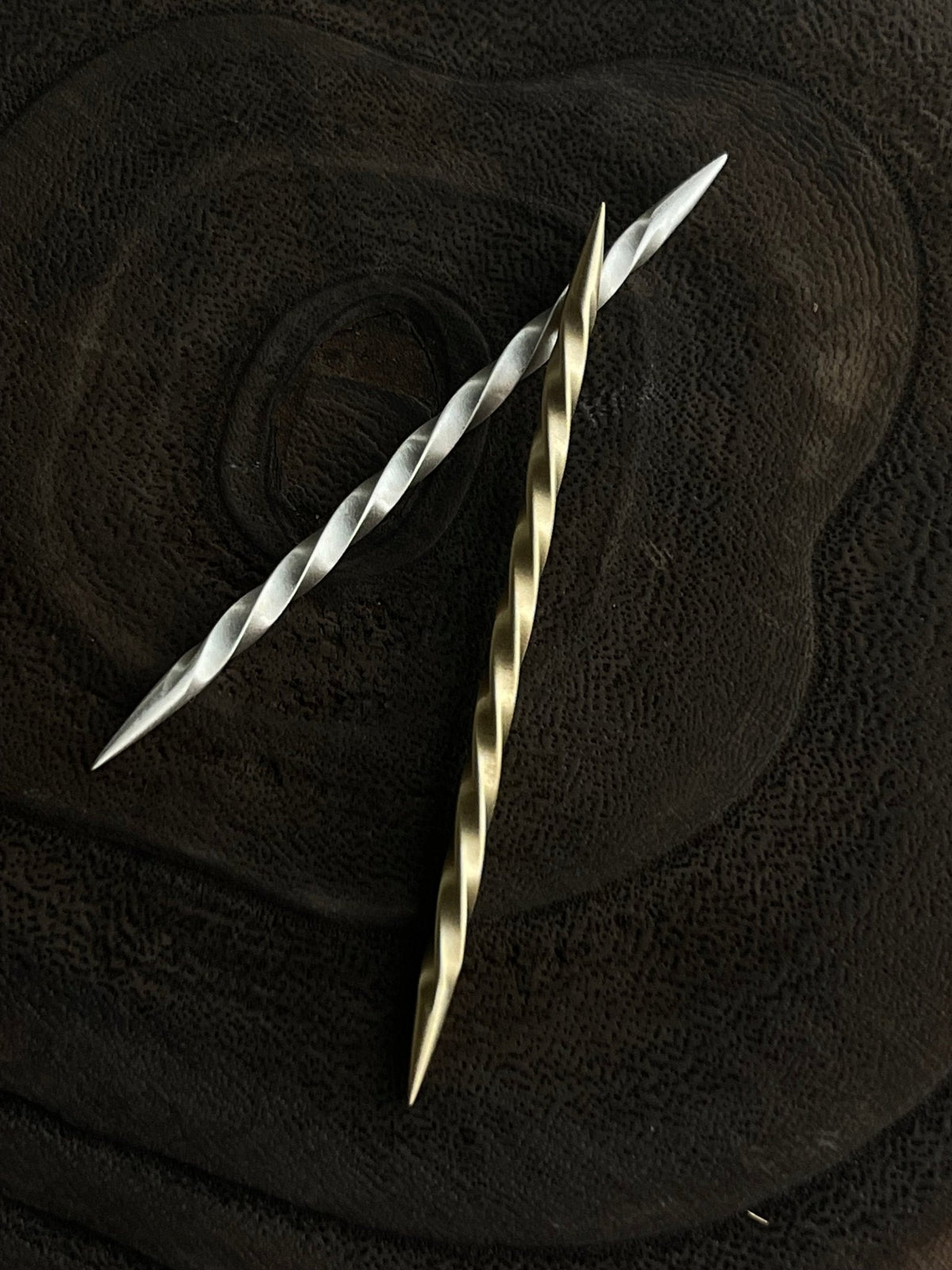 Handmade Boles Silver cowboy hat pin with a toothpick design, crafted as a unique cowboy-themed accessory.