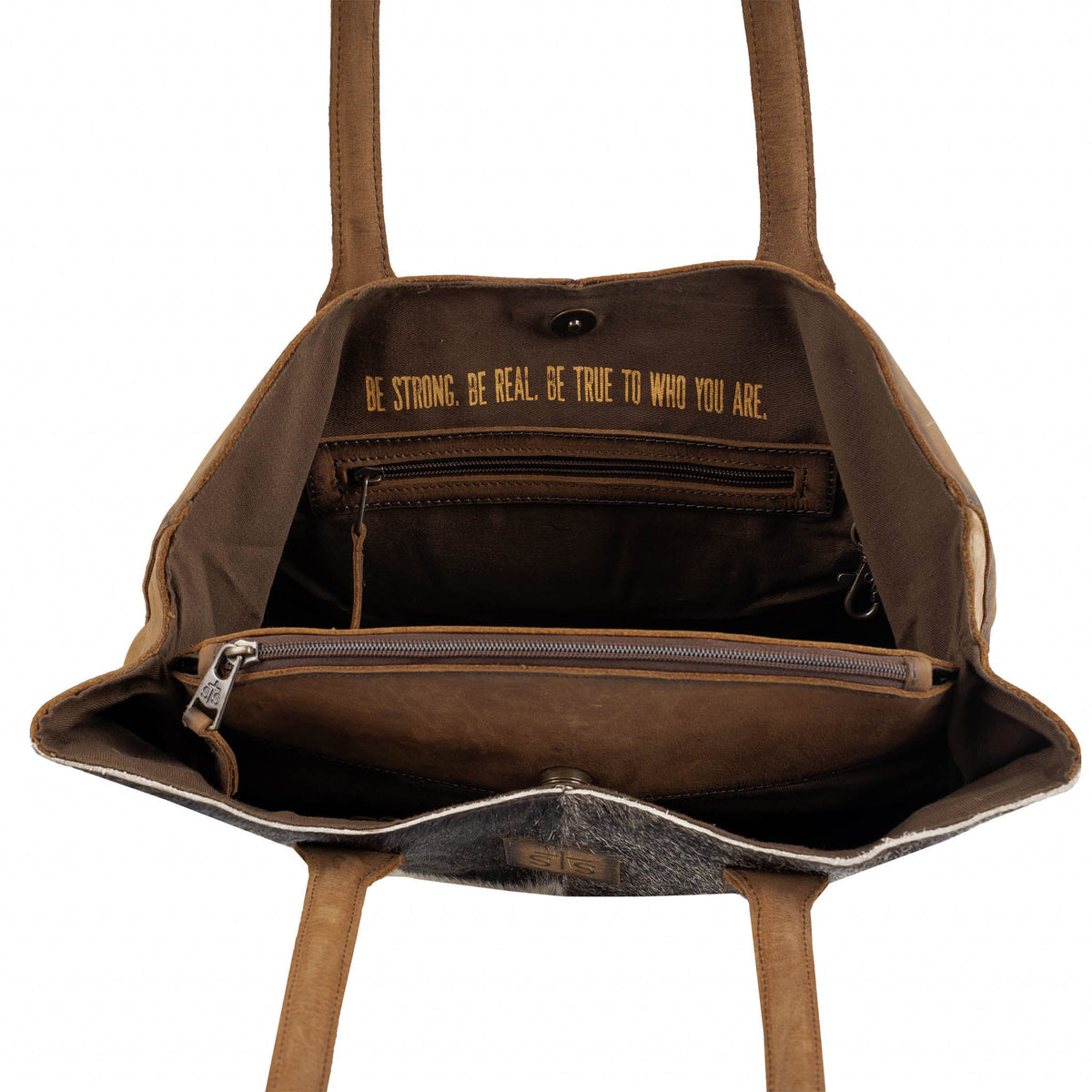 Cowhide Josie Tote from STS Ranchwear featuring durable leather straps and a spacious interior, showcasing stylish Western design.