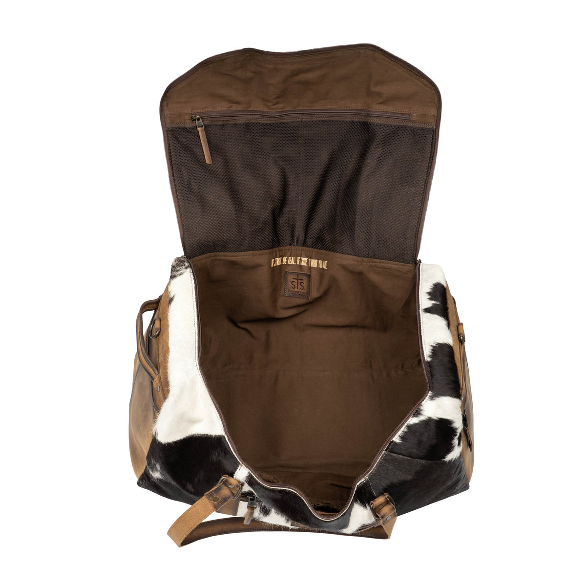 STS Ranchwear Cowhide Rustler Duffle bag in natural cowhide leather with sturdy handles and spacious interior for travel.