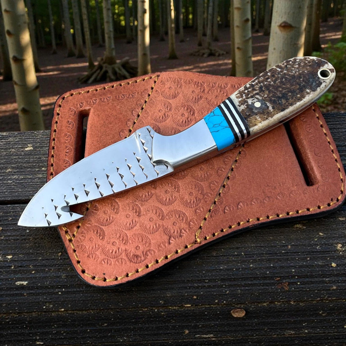 Malika Knives D2 Steel Cowboy Gut Hook Knife with 5mm thick blade and pancake sheath, displayed on a plain background.
