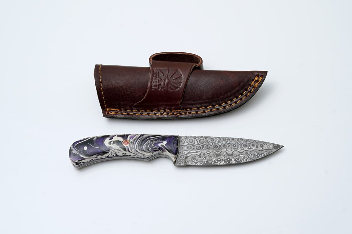 Damascus Steel EDC knife by Titan International K with Midnight Prism handle, designed for hunting and survival tasks.