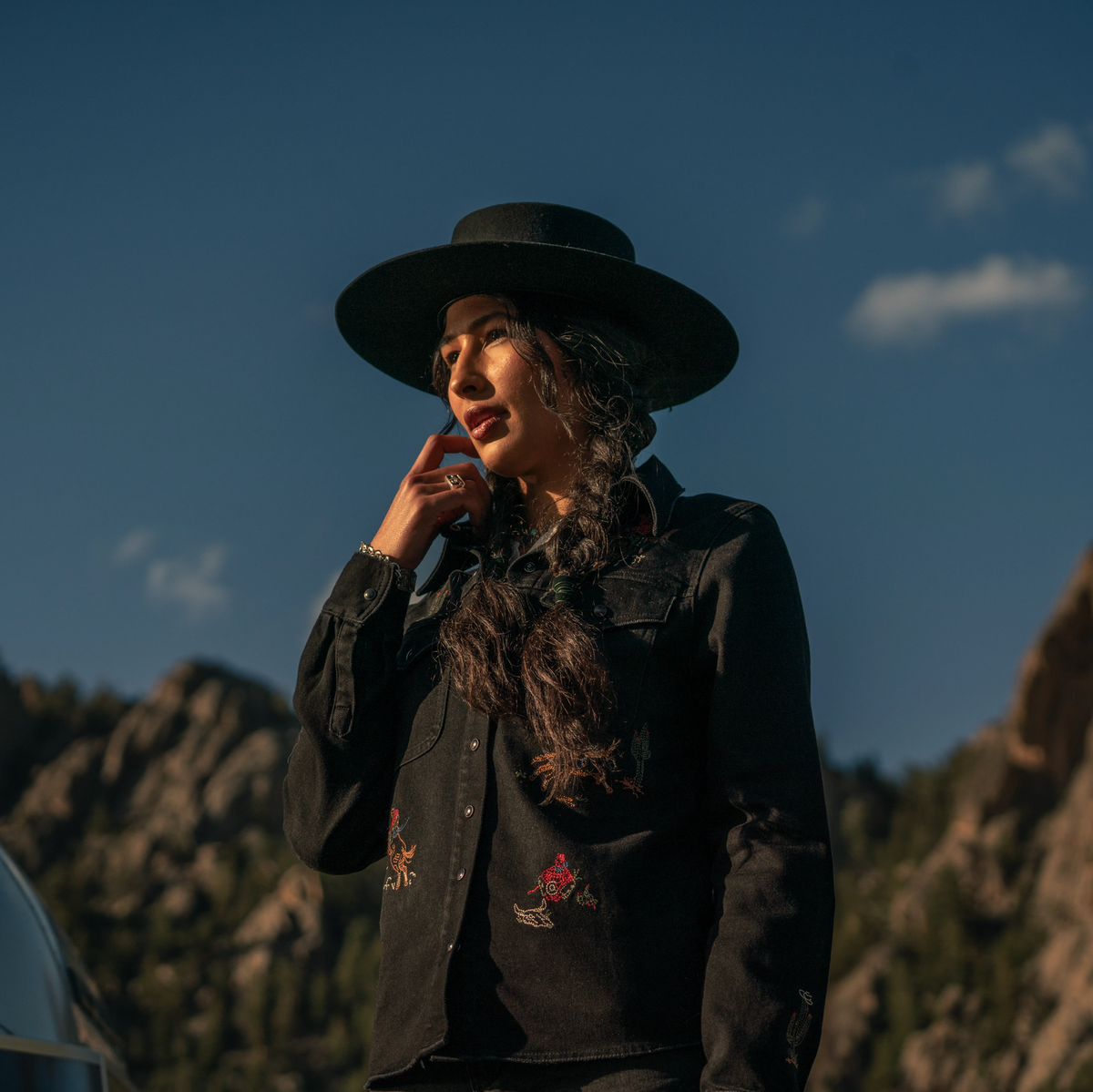 Stetson black denim shirt with embroidered design, long sleeves, and button-up front, displayed on a hanger.