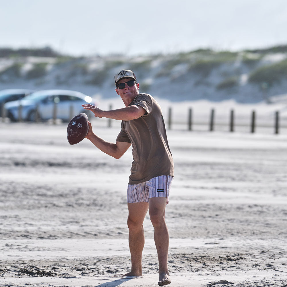 Hooey Breaker boardshort in cream and stripe pattern, featuring a casual, comfortable fit for beach or swimwear.