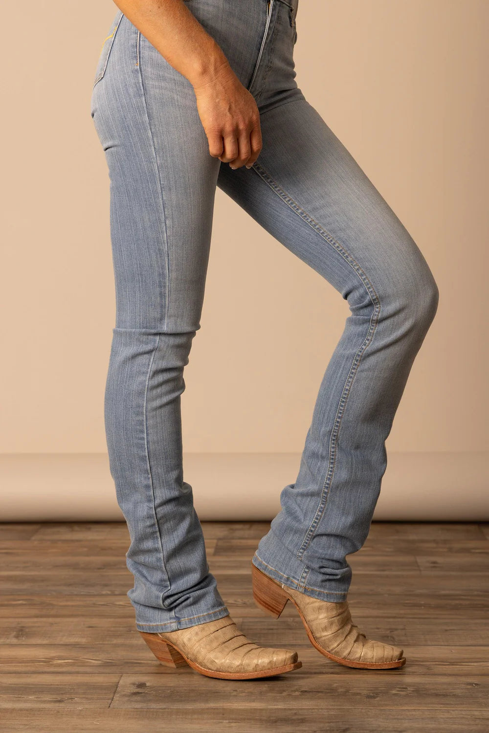 Light wash Kimes Ranch Women's Sarah jeans, stylish denim with classic fit, detailed stitching, and five-pocket design.