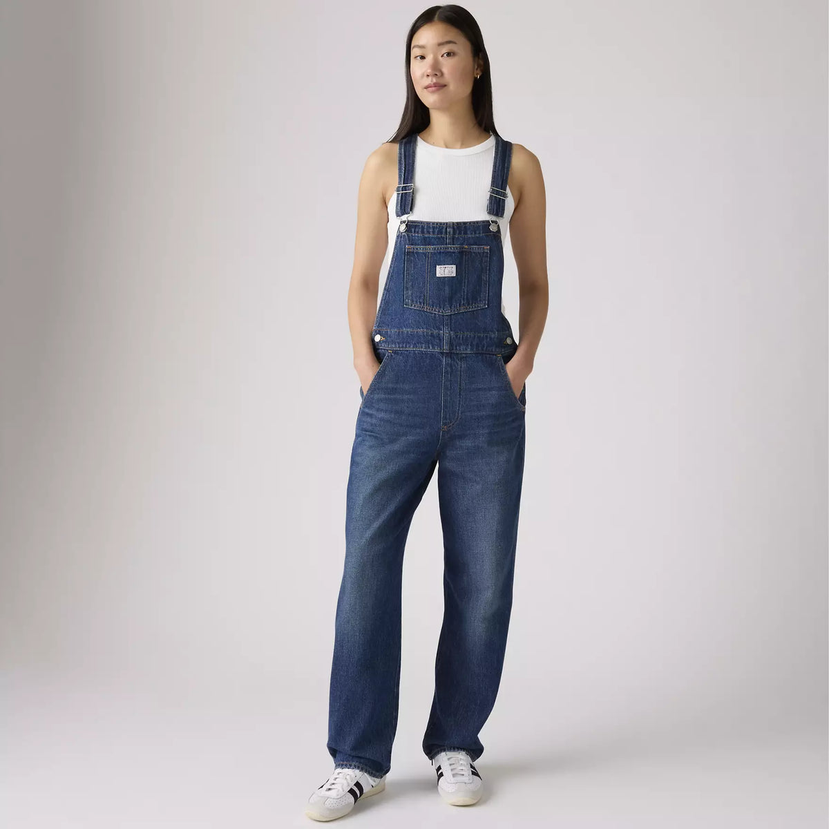 Levi's Women's Vintage Denim Overalls in dark wash, featuring classic straps, front pockets, and relaxed fit.