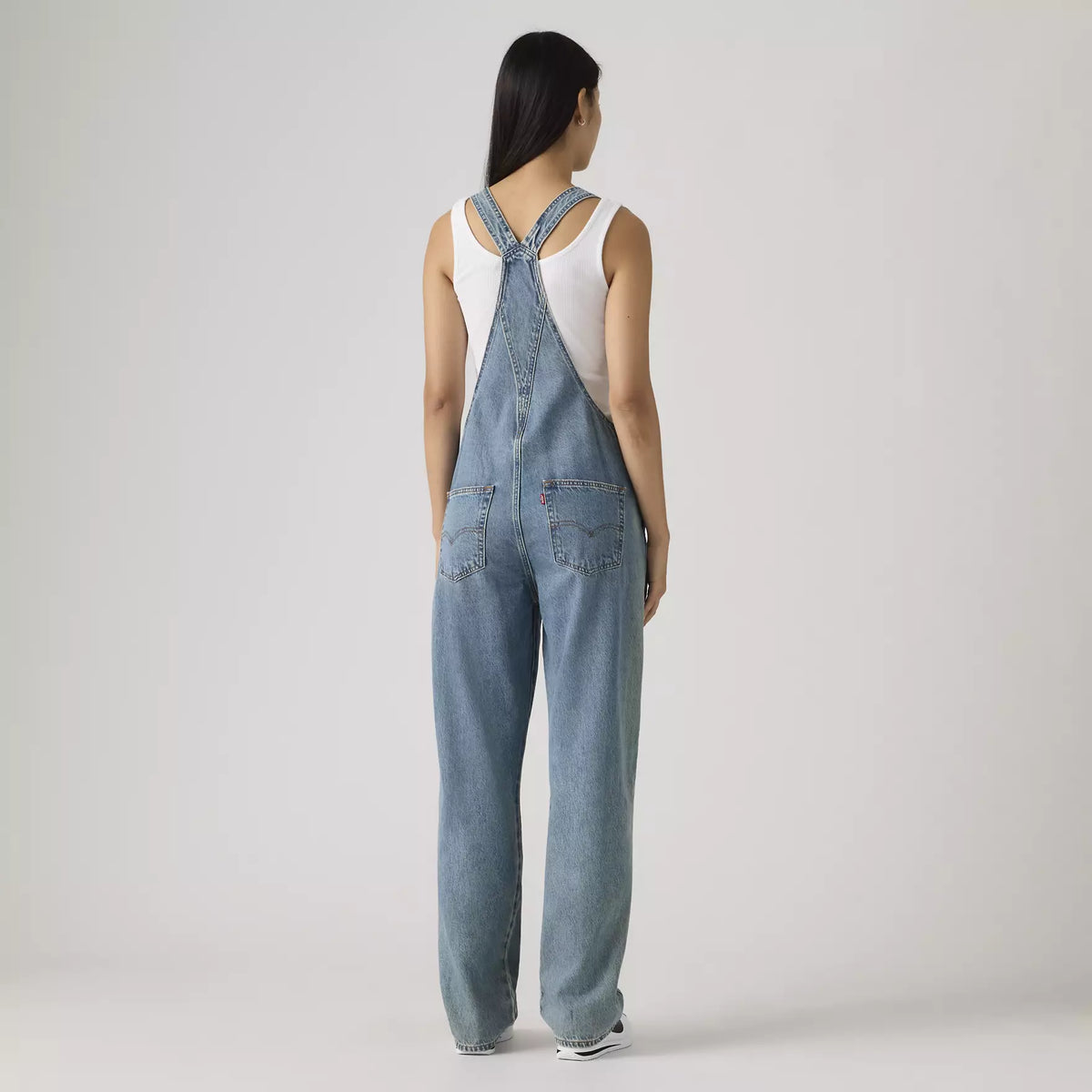 Levi's women's vintage denim overalls in medium wash with adjustable straps and classic pocket details.