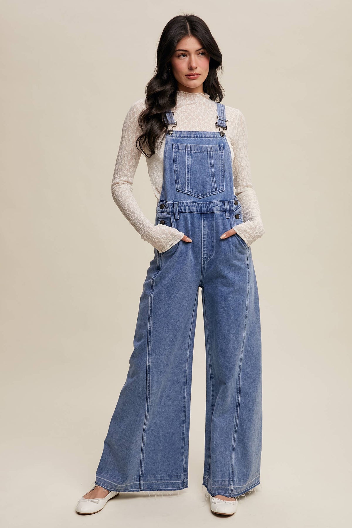 Wide-leg denim overalls by Listicle featuring classic style, adjustable straps, and functional pockets, perfect for casual wear