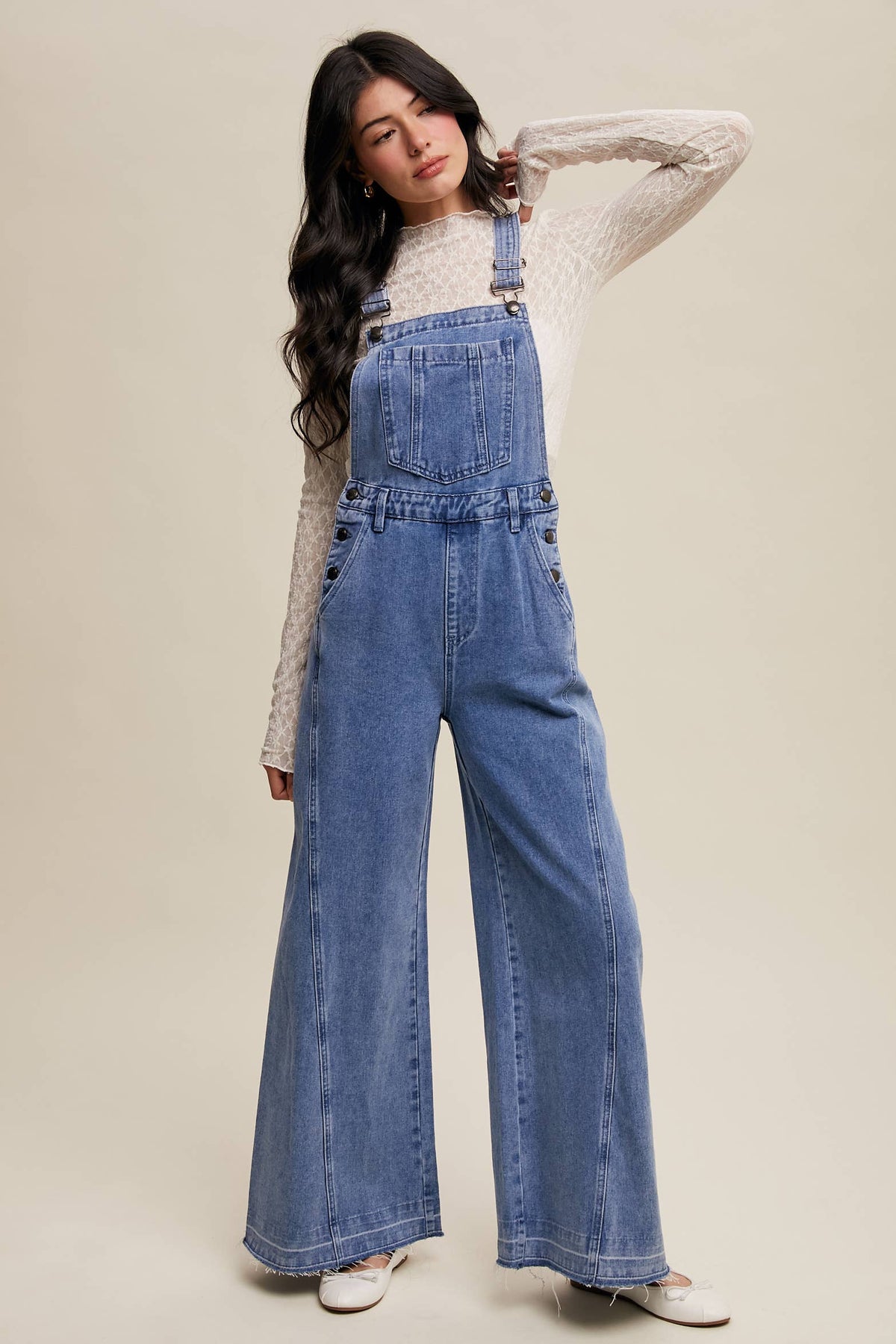 Wide-leg denim overalls by Listicle featuring a relaxed fit and classic blue wash, displayed on a mannequin.