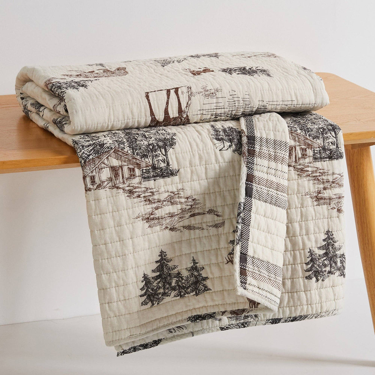 Levtex Home Lodge Toile quilted throw blanket with lodge and toile pattern, soft and cozy for home decor or warmth.