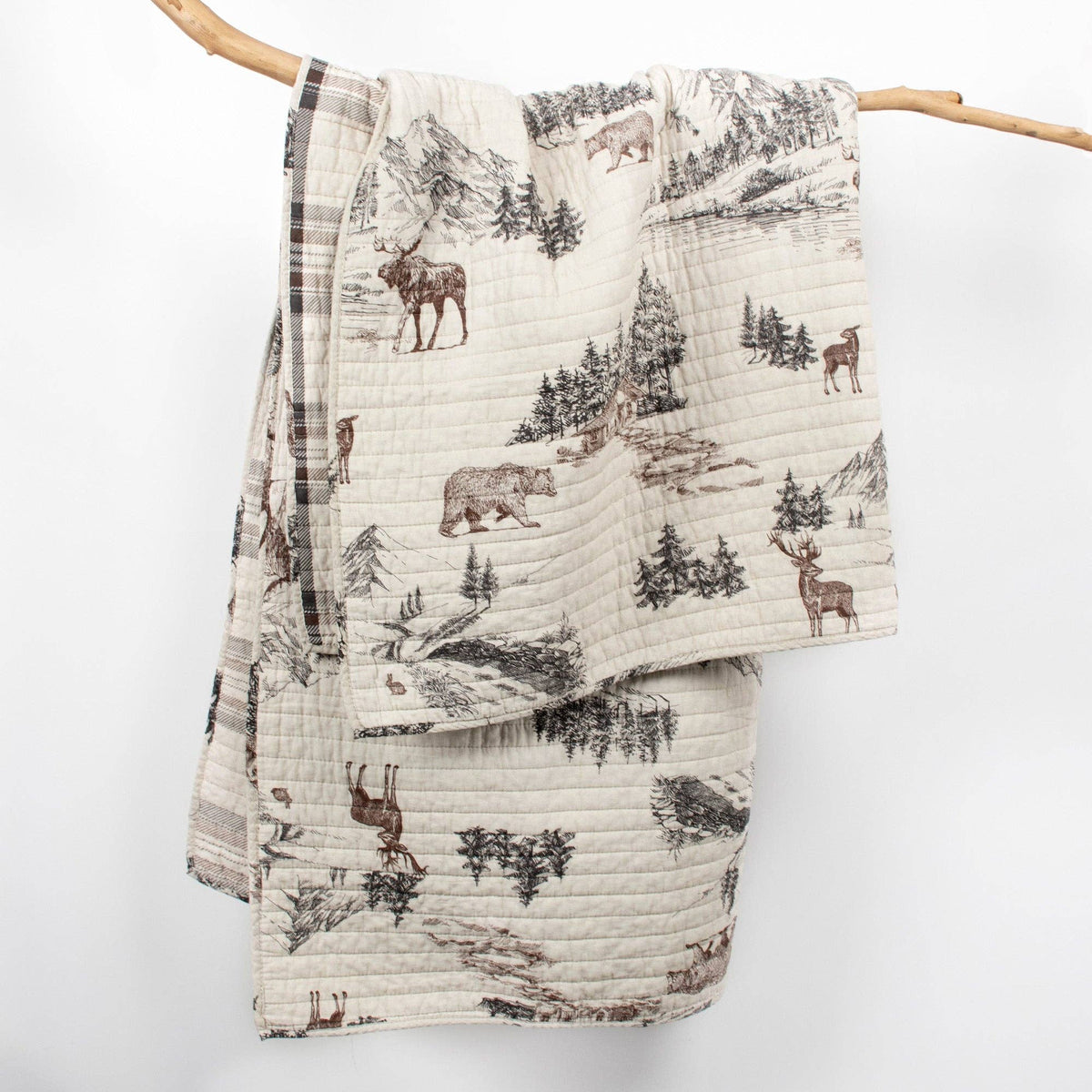Levtex Home Lodge Toile quilted throw blanket with lodge toile pattern, soft fabric, and cozy design for home decor.