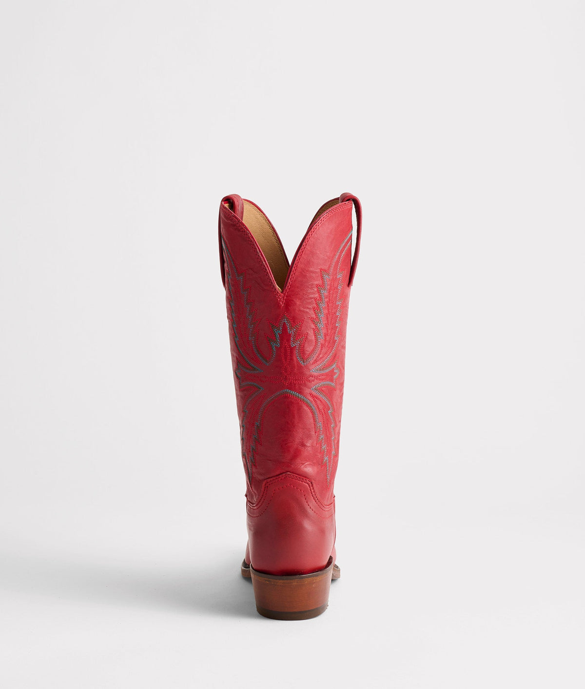 Red Lucchese Savannah boot with detailed stitching and pointed toe, crafted from smooth leather.