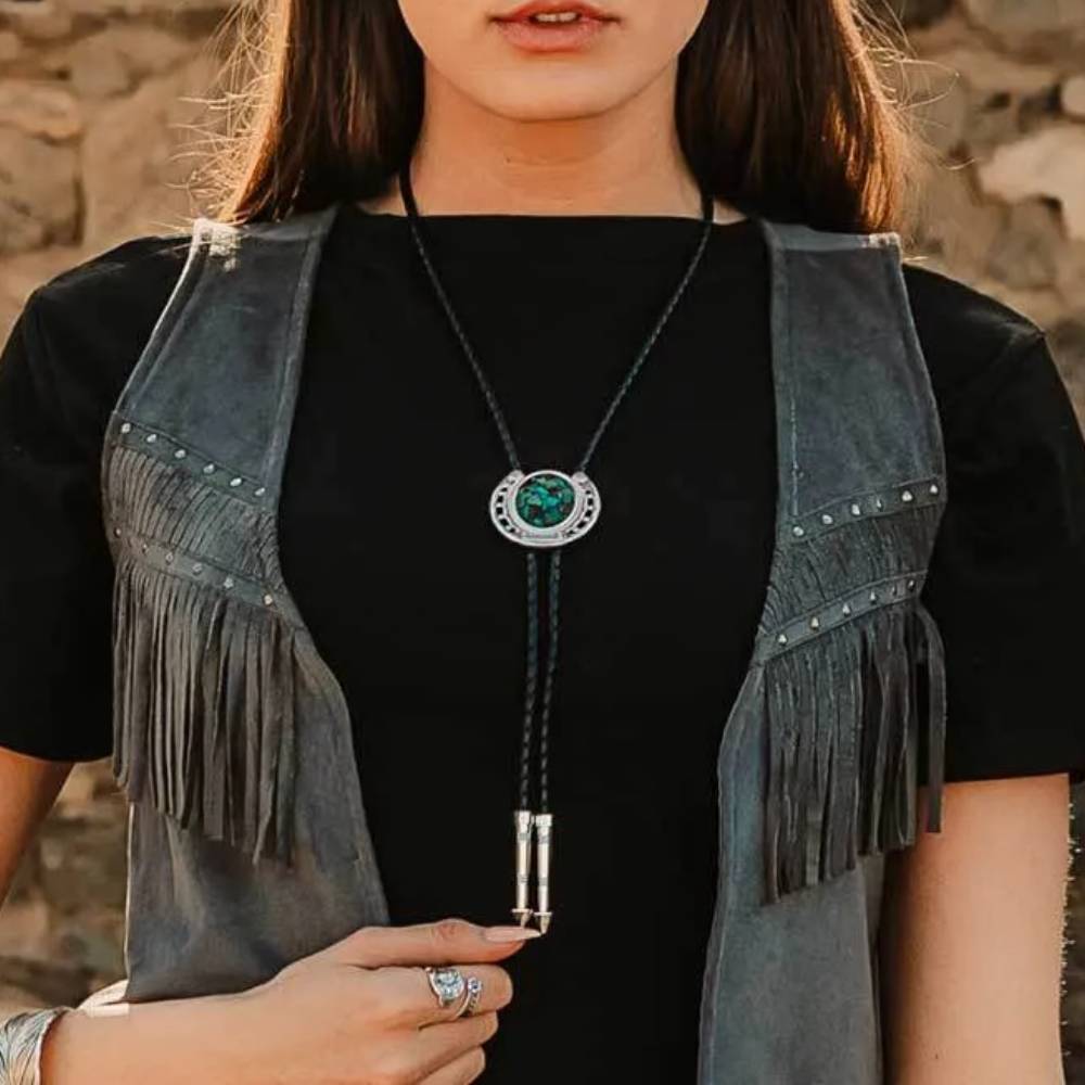 Montana Silversmiths The Pioneer's turquoise bolo tie with silver accents and detailed Western-inspired design.