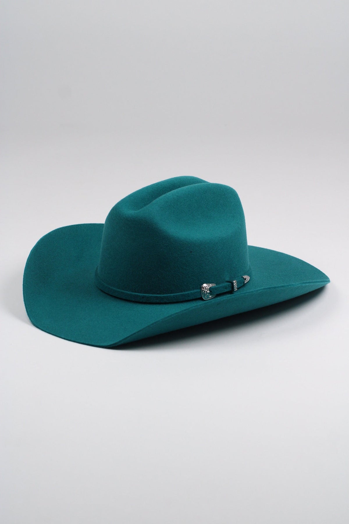 Wilder and Soul Mustang in turquoise with detailed leather craftsmanship and decorative stitching.