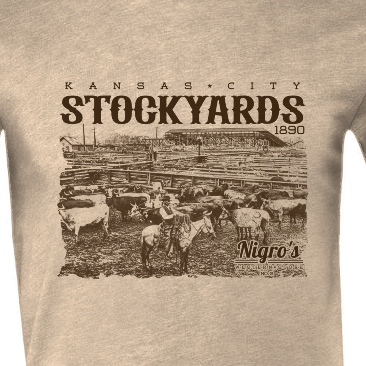 Nigro's Western Store Kansas City Stockyards T-Shirt, Heather Tan – logo close-up