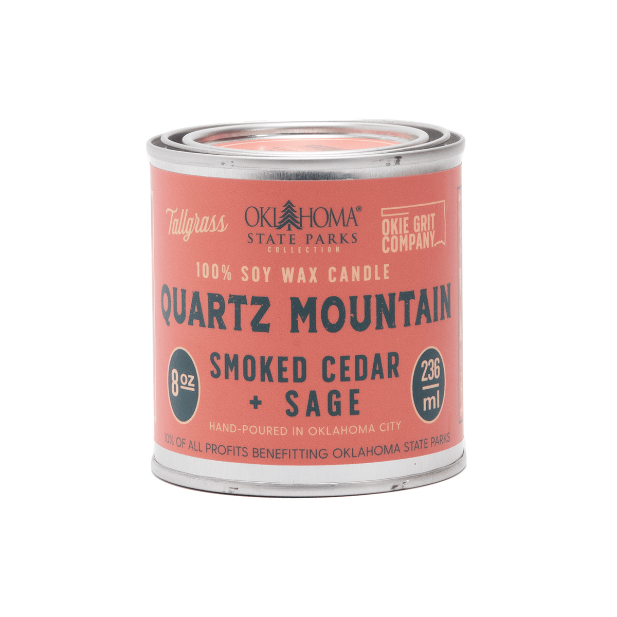 Tallgrass Supply Quartz Mountain soy wax candle with smoked cedar and sage scent, featuring a rustic candle holder.