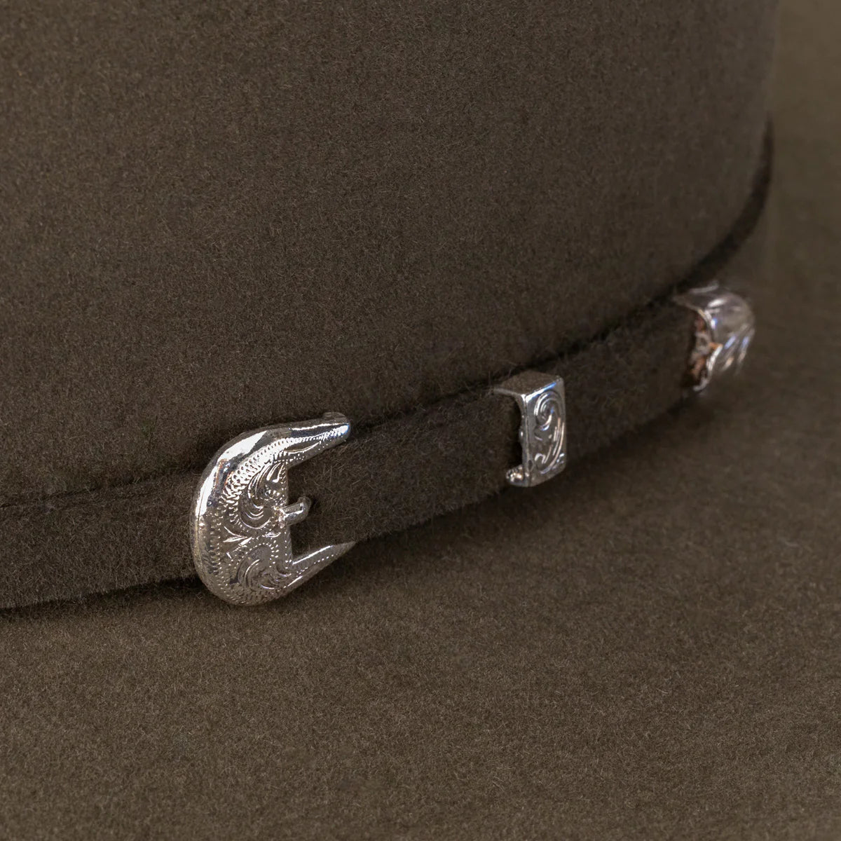 Resistol 6X Midnight Cowboy Hat in sage color, featuring a wide brim and classic cowboy style with leather band detail.