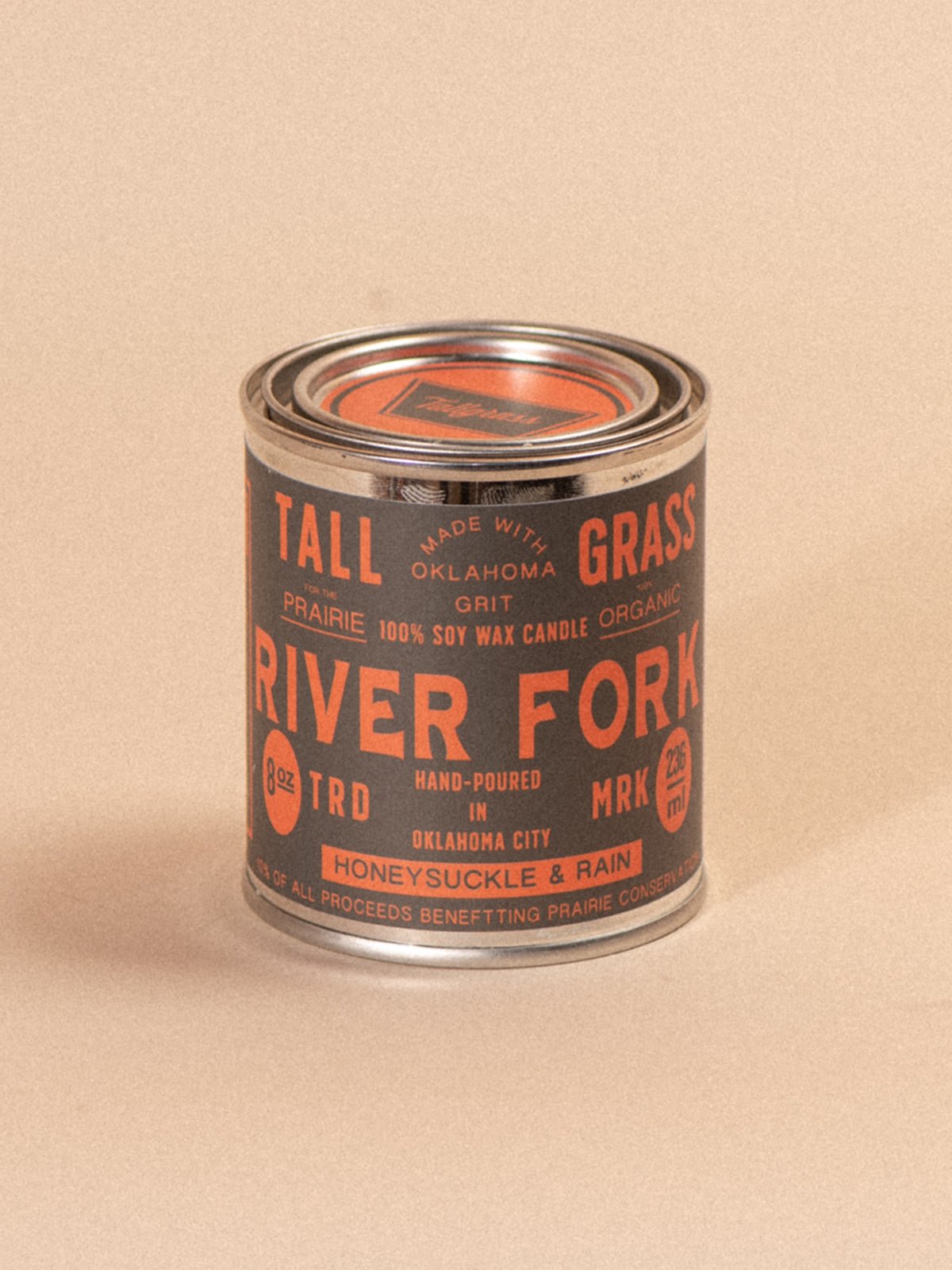Tallgrass Supply River Fork Honeysuckle and Rain soy wax candle in a glass jar with a wooden lid, scented and decorative.