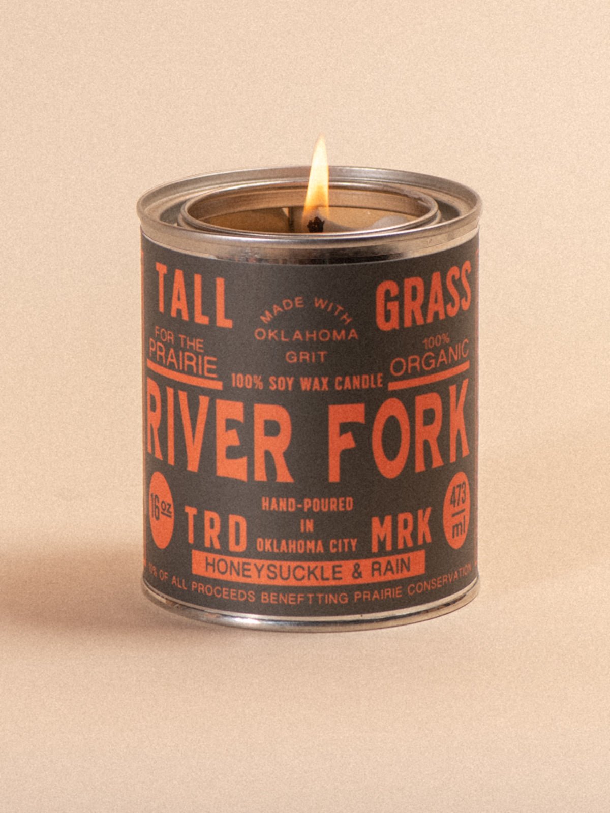 Tallgrass Supply River Fork soy wax candle with honeysuckle and rain scent, featuring a tall, elegant candle design.
