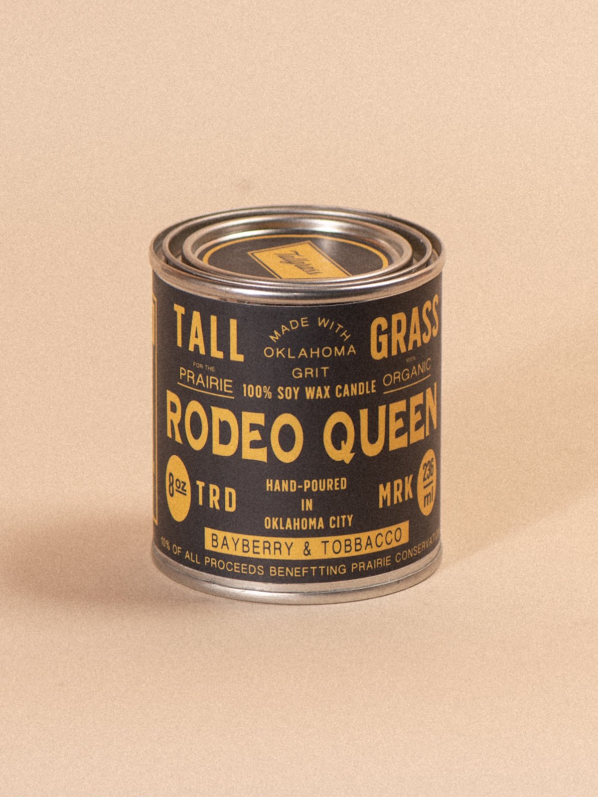 Tallgrass Supply Rodeo Queen soy wax candle featuring bayberry and tobacco scents, with a tall, elegant candle design.