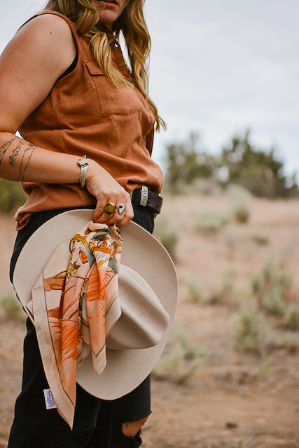 Tirzah Lane Art September Ride Cowgirl silk scarf, wild rag featuring a colorful western-themed design with cowgirl motifs.