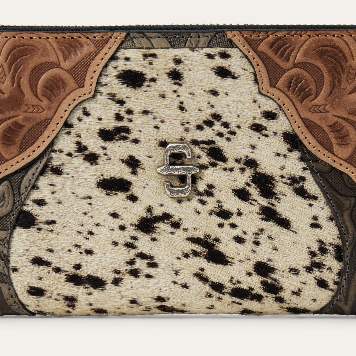 Stetson Hair-On-Hide Tooled Zip Wallet by Gem Dandy featuring leather with intricate tooling and a secure zipper closure.