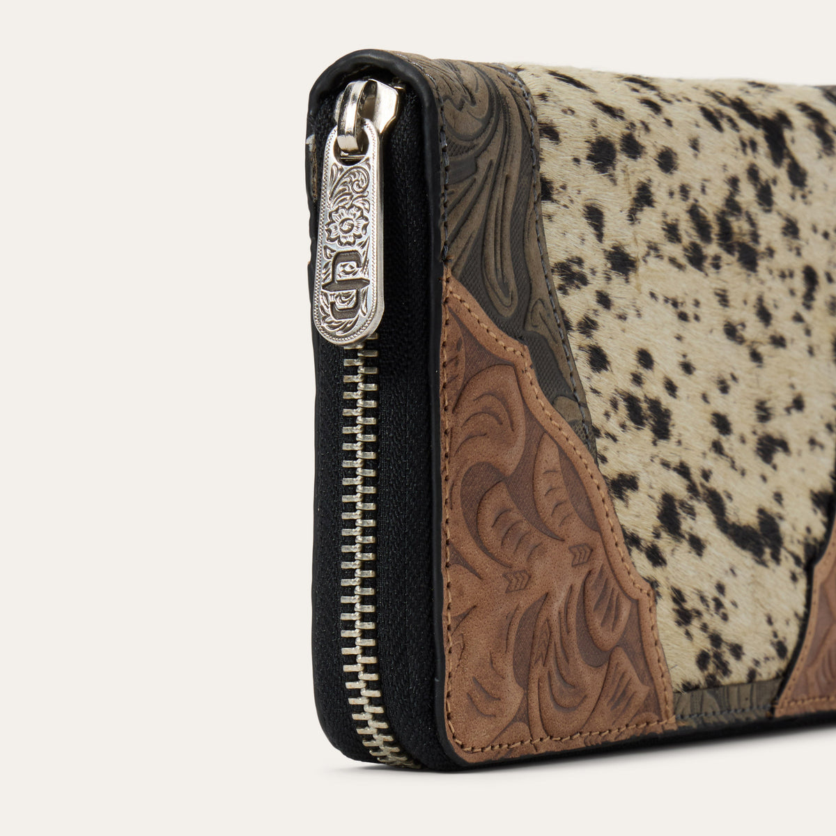 Stetson Hair-On-Hide Tooled Zip Wallet by Gem Dandy showing detailed leather tooling and zip closure.