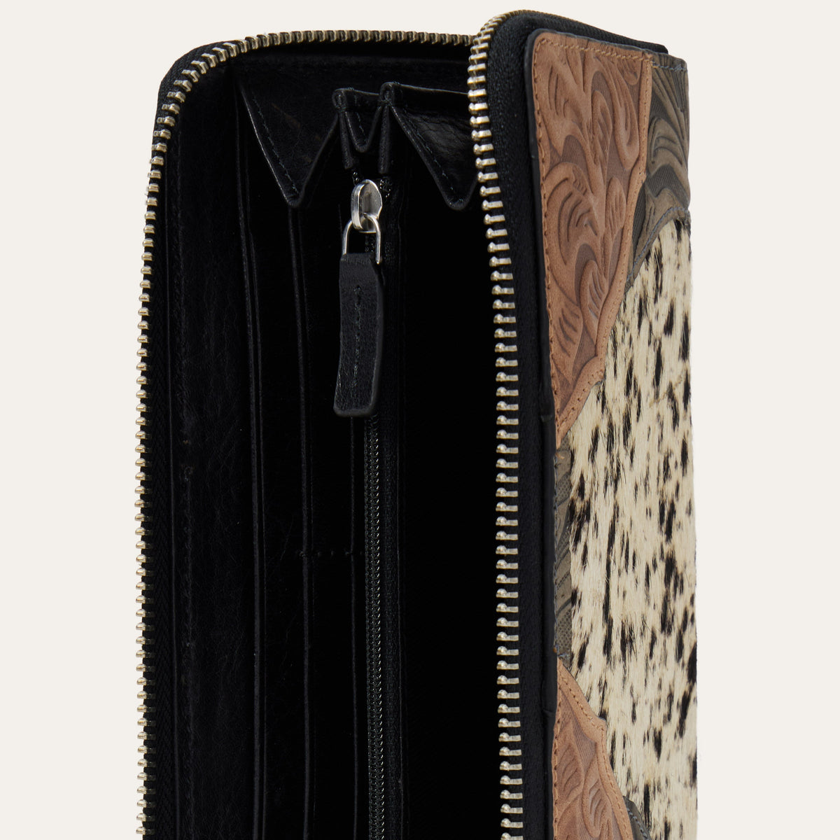 Stetson Hair-On-Hide Tooled Zip Wallet by Gem Dandy featuring detailed tooling and genuine leather hair-on-hide texture.