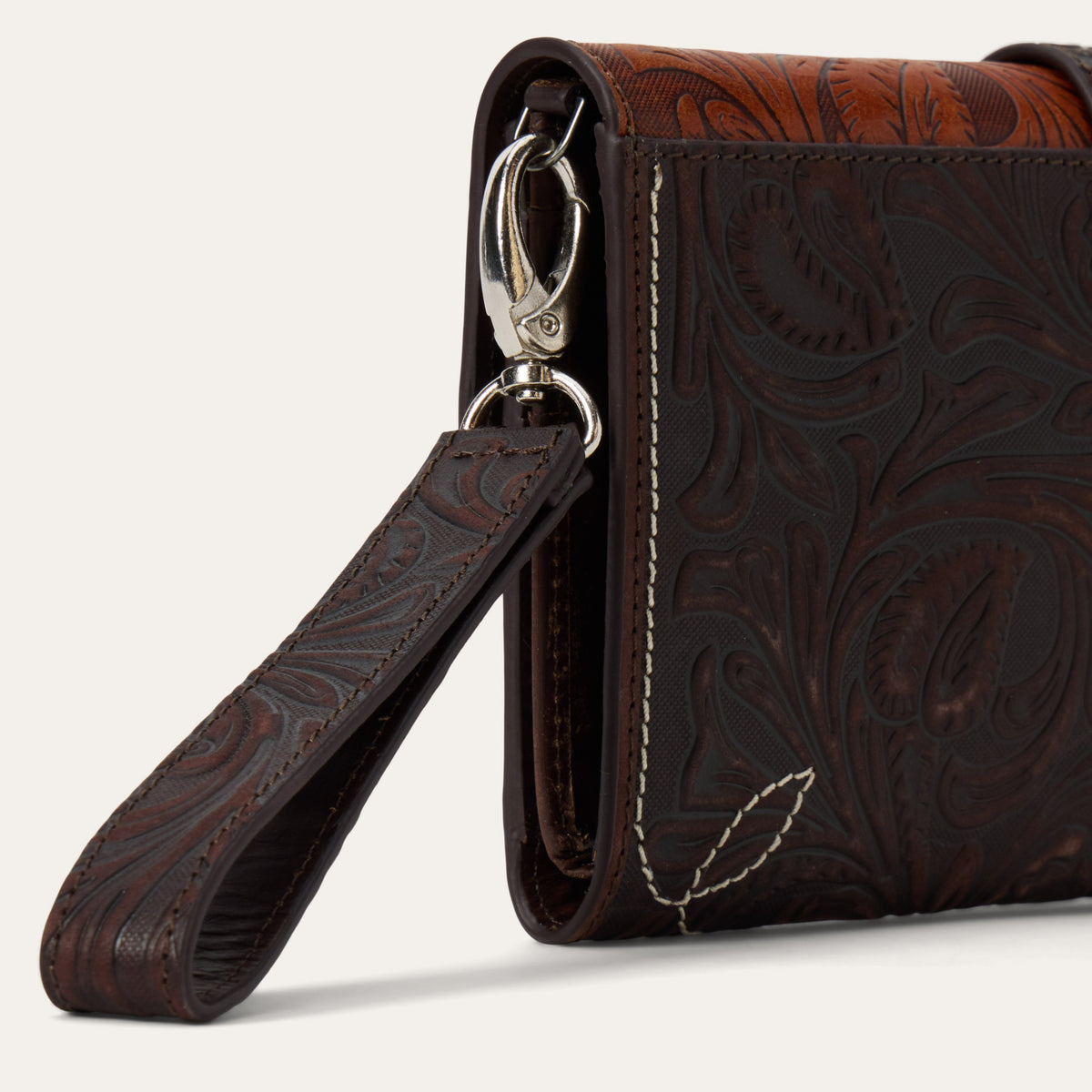 Stetson Tooled Clutch Wallet by Gem Dandy, showcasing detailed tooled leather design with multiple card slots and a secure snap closure.