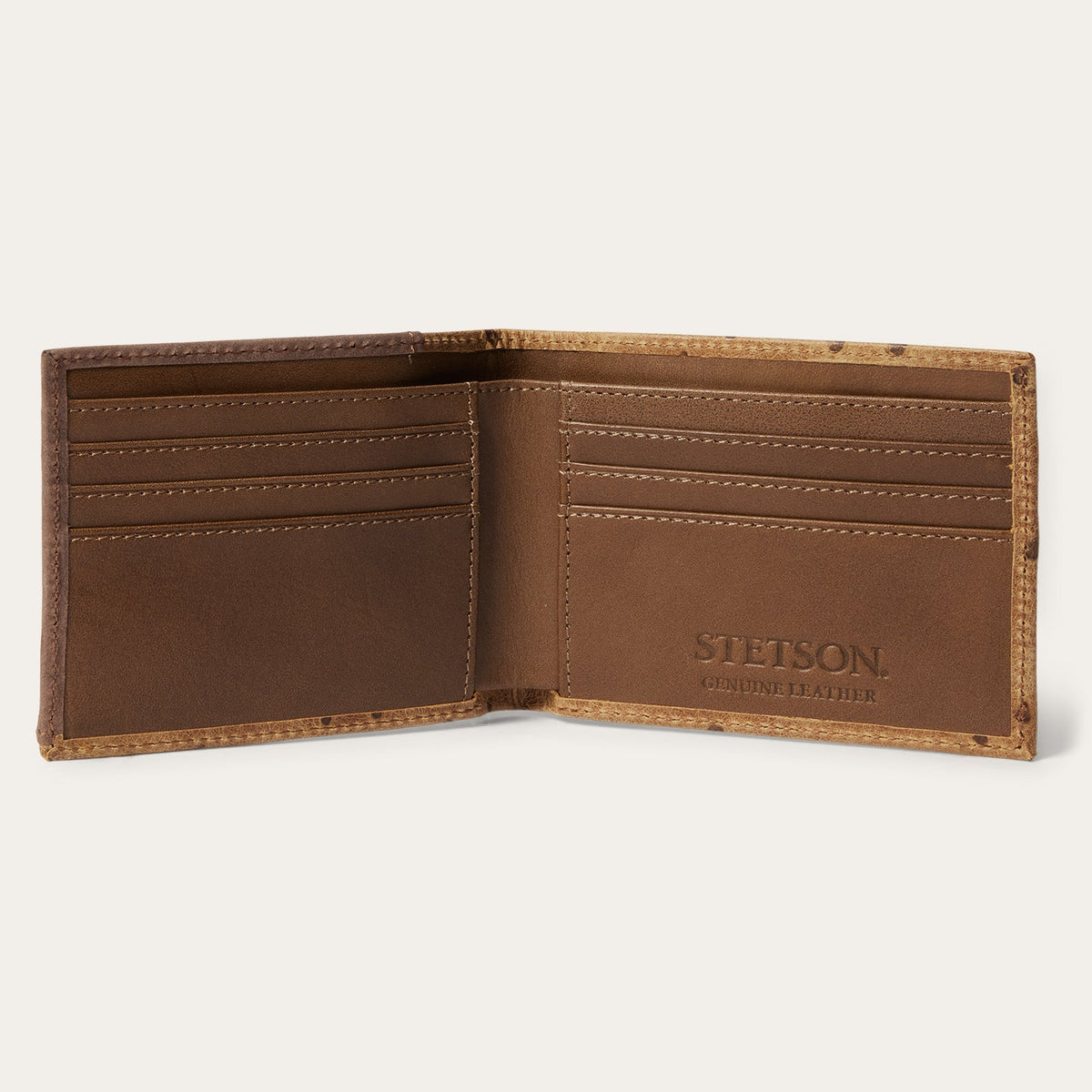 Stetson tooled embossed ostrich bi-fold wallet by Gem Dandy, featuring detailed leather craftsmanship and multiple card slots.