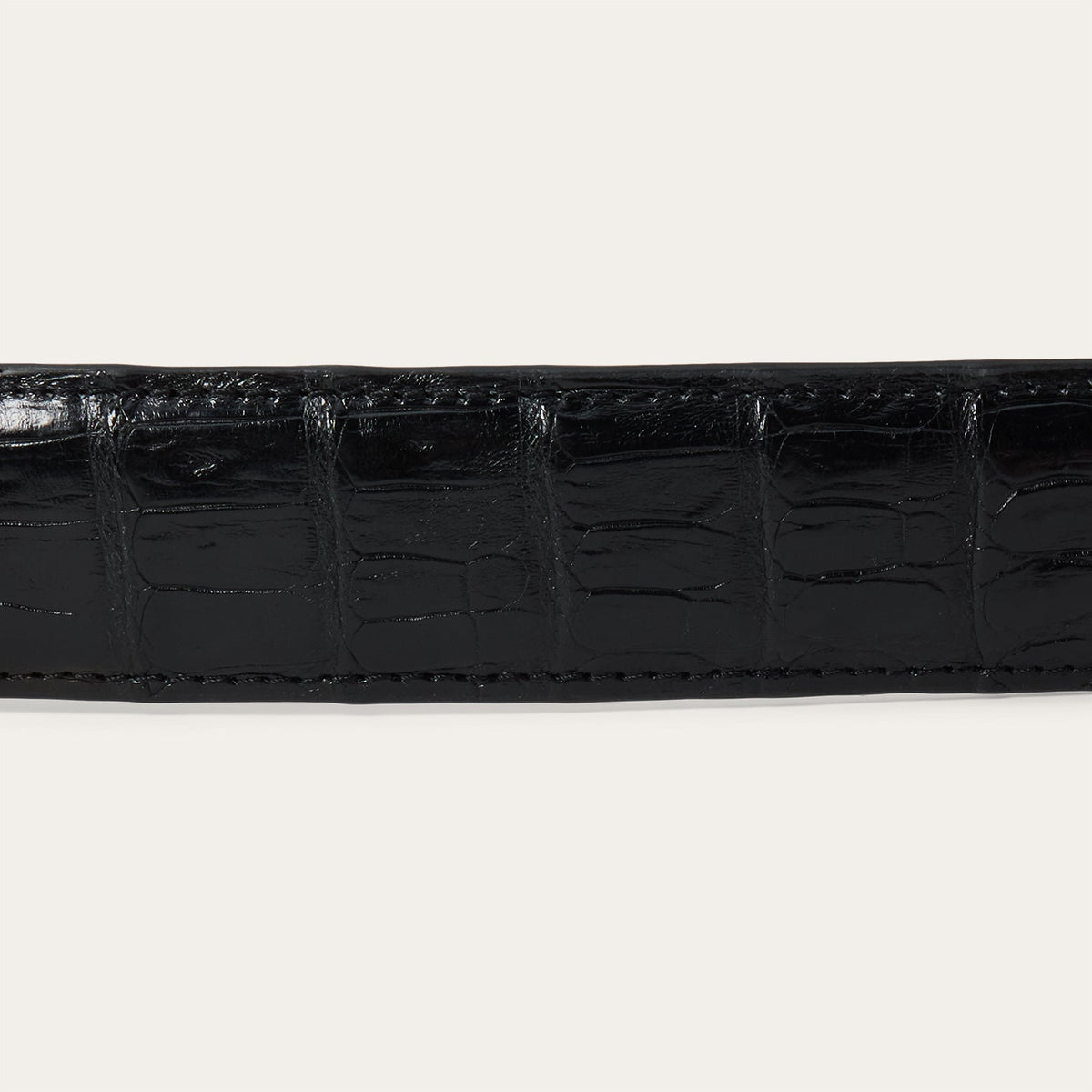 Stetson women's black caiman leather tapered tab belt with classic design and silver buckle, stylish accessory for various outfits.
