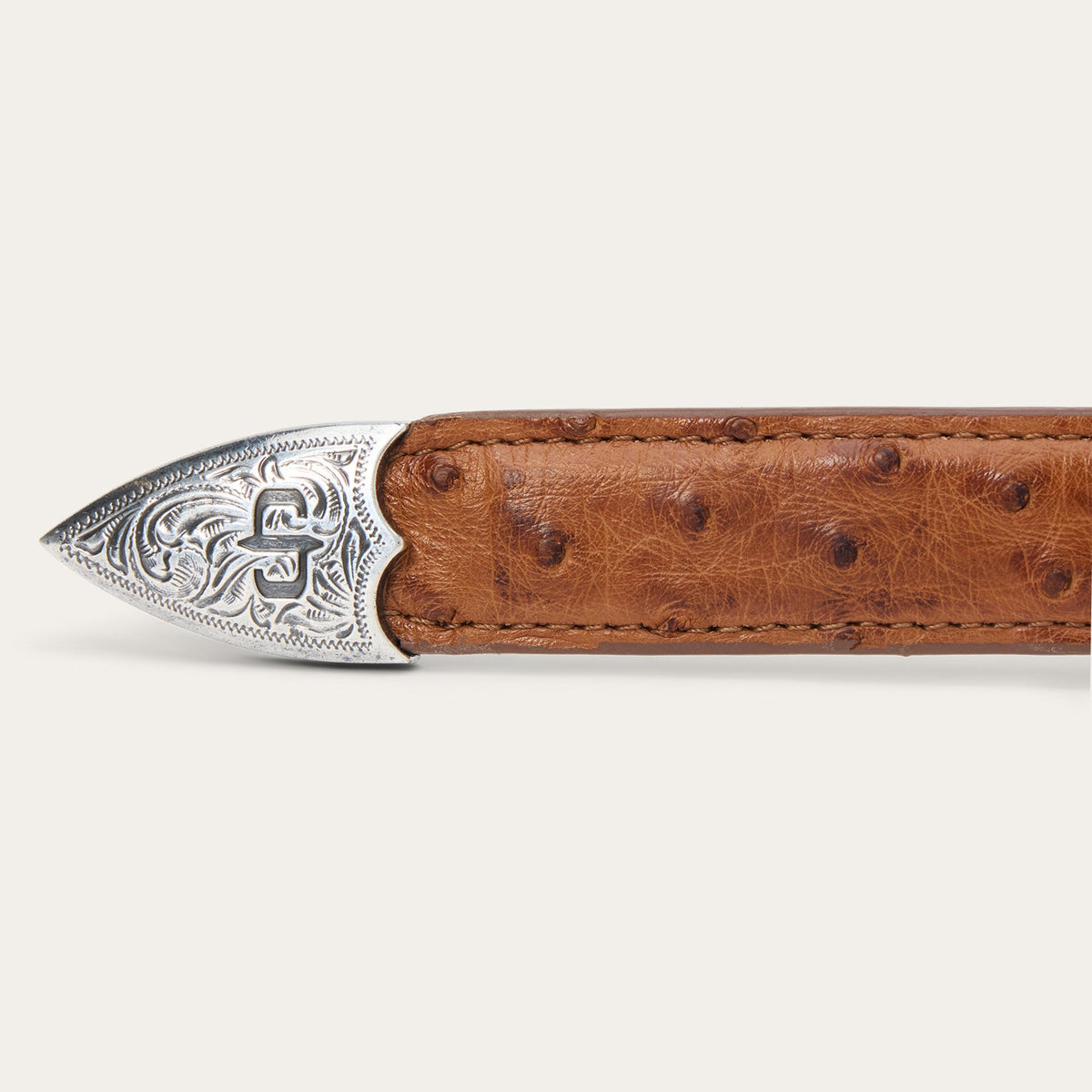 Stetson women's ostrich leather tapered tab belt in antique cognac, featuring a textured finish and metal buckle.