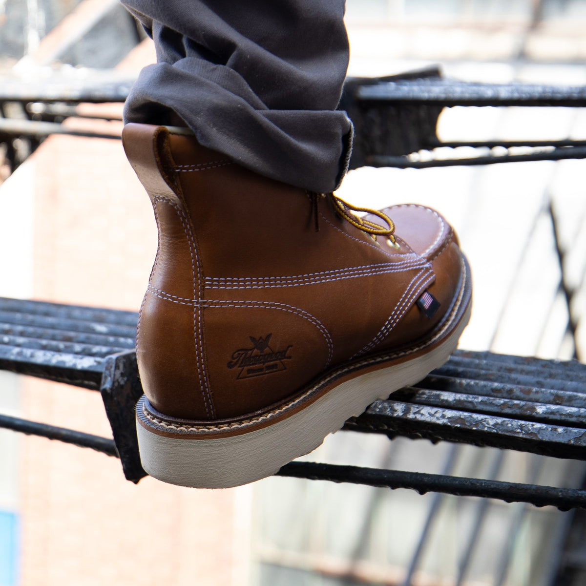 Thorogood American Heritage 6" Tobacco moc toe on a fire escape step