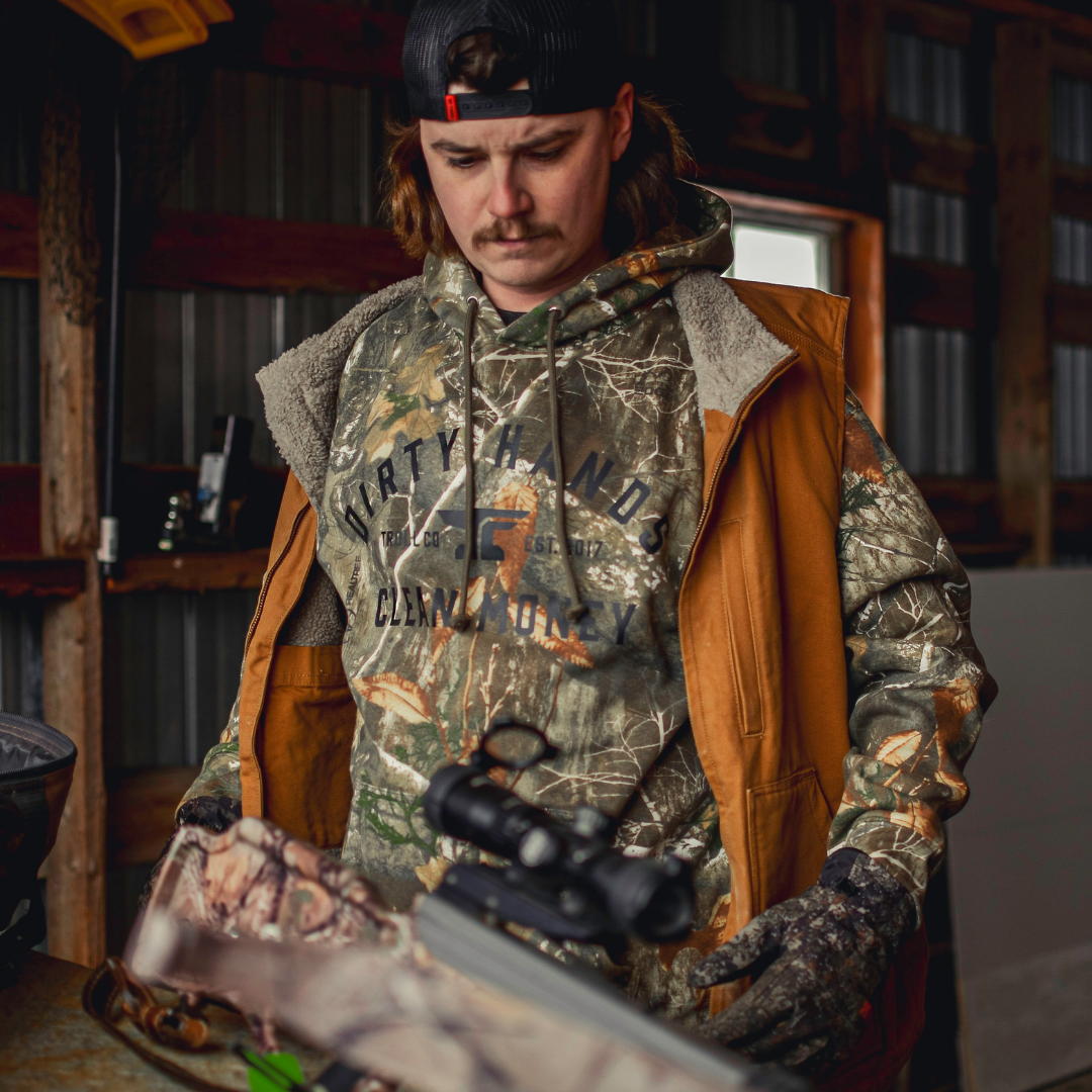 Troll Co. DHCM Classic RealTree hoodie worn at a workbench